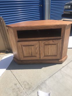 Brand new solid oak corner tv entertainment center. Retails for over $500.