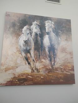 Galloping white horses