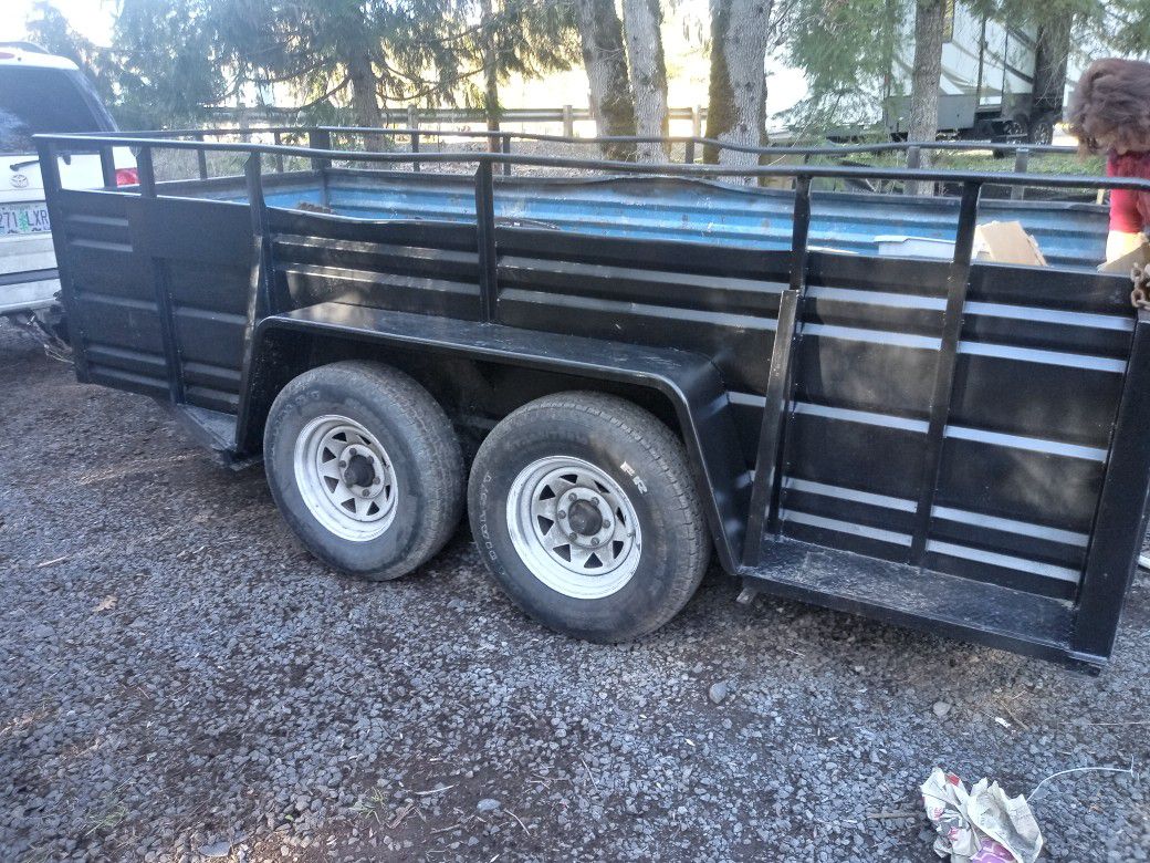 12ft long-5ft wide with high walls. tandem axle, open ramp back, heavy duty utility, construction or landscaping trailer. $1600 OBO