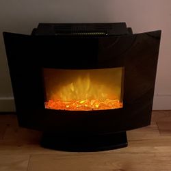 Glass fireplace / electric heater with rocks and fire animation.  
