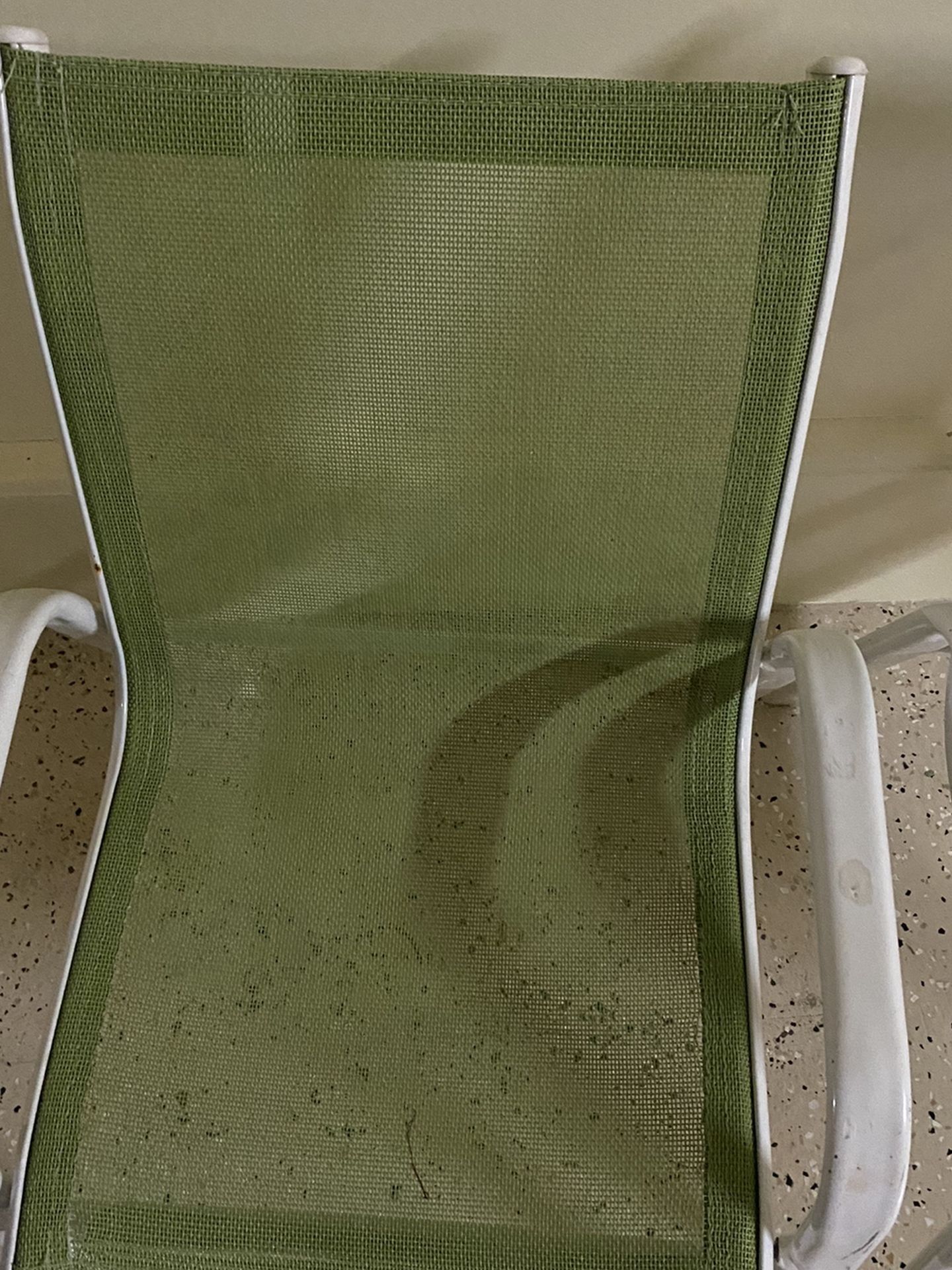 A pair of iron kids chairs