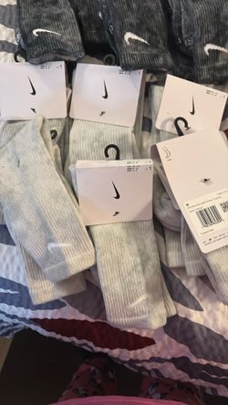 Nine pairs of the dark color, six pair of the light all brand new