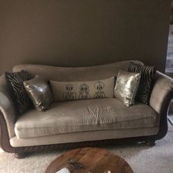 Elegant Cream Sofa with Silver and Zebra Accent Pillows