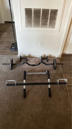 Weights 2 dumbbells 1 curl bar and 30 pounds in weights and a pull-up bar and push up