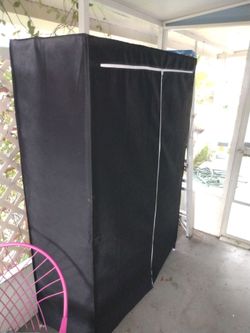 Large portable closet with shells brand new