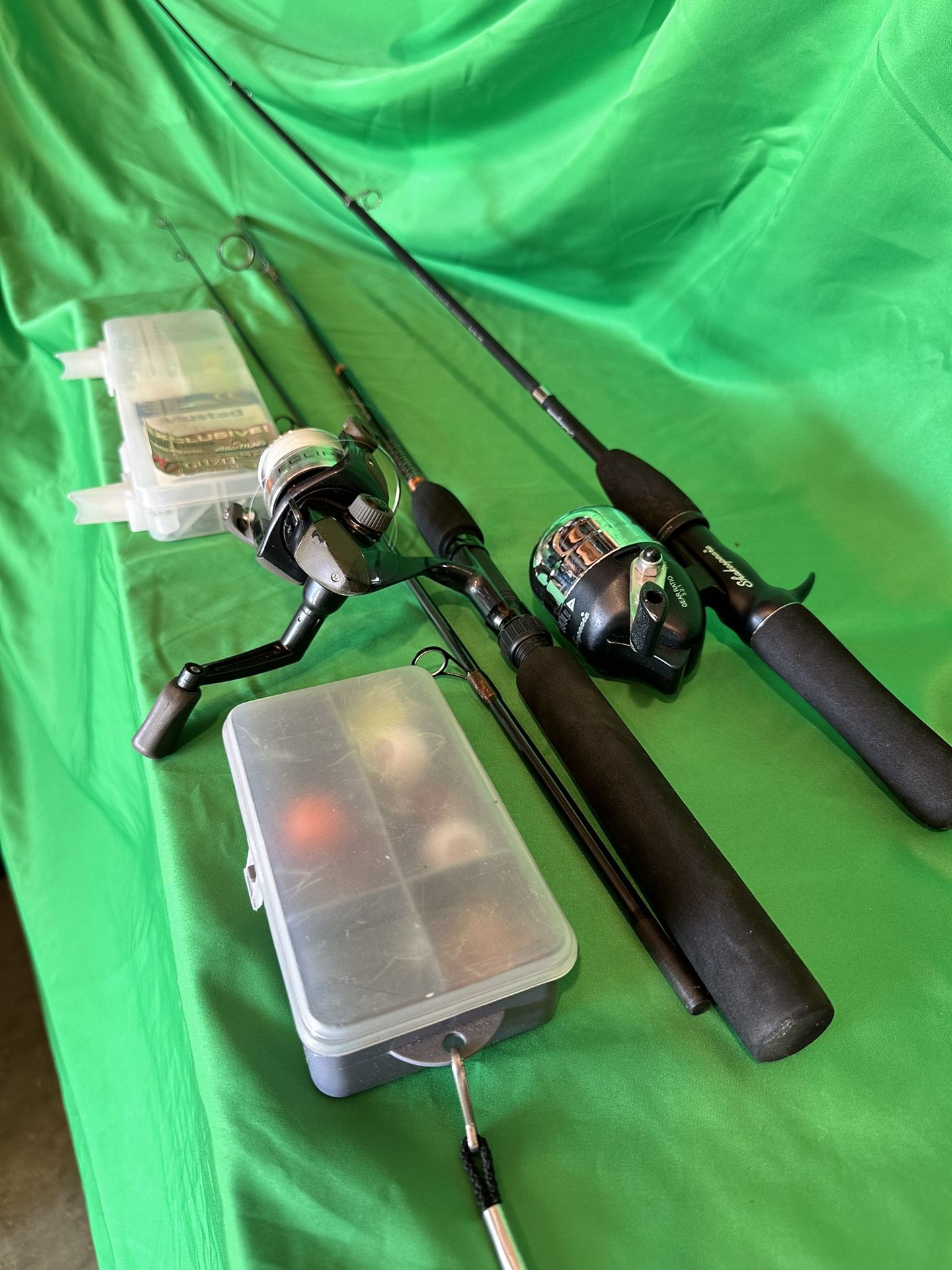 Two Fishing Rods, Reels, and Assorted Tackle