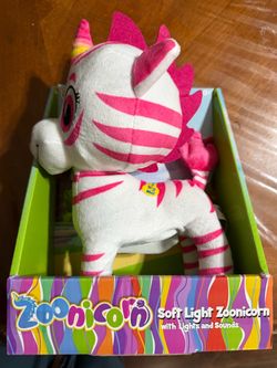 Plush toy with glowing horn and cute character phrases, squeeze belly to activate lights, soft polyester material for kids New
