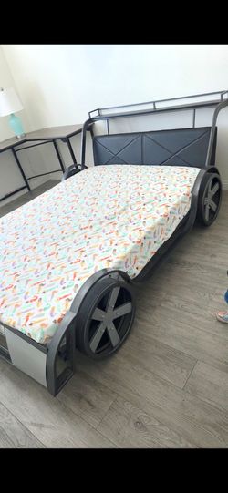 Full size car bed. Metal frame. No mattress