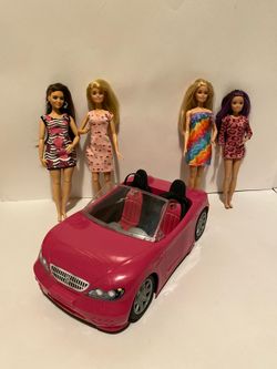 Barbie convertible car with four dolls