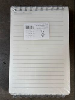 New spiral notebook, sealed in plastic.