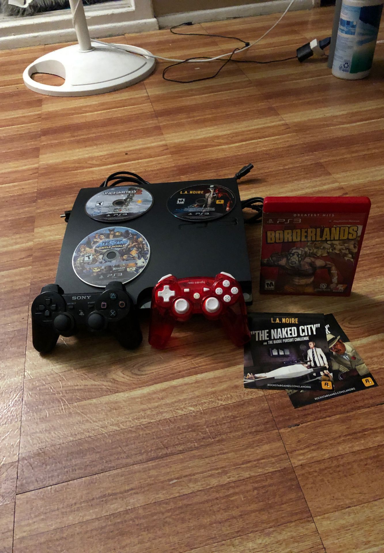PS3 with controllers and 4 games