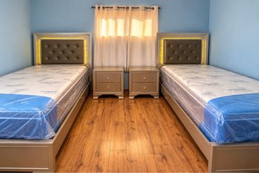 2 beautiful twin beds with nightstands and mattress