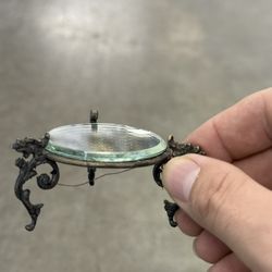 antique or vintage mirrored plateau, also known as a plateau mirror or vanity plateau. 