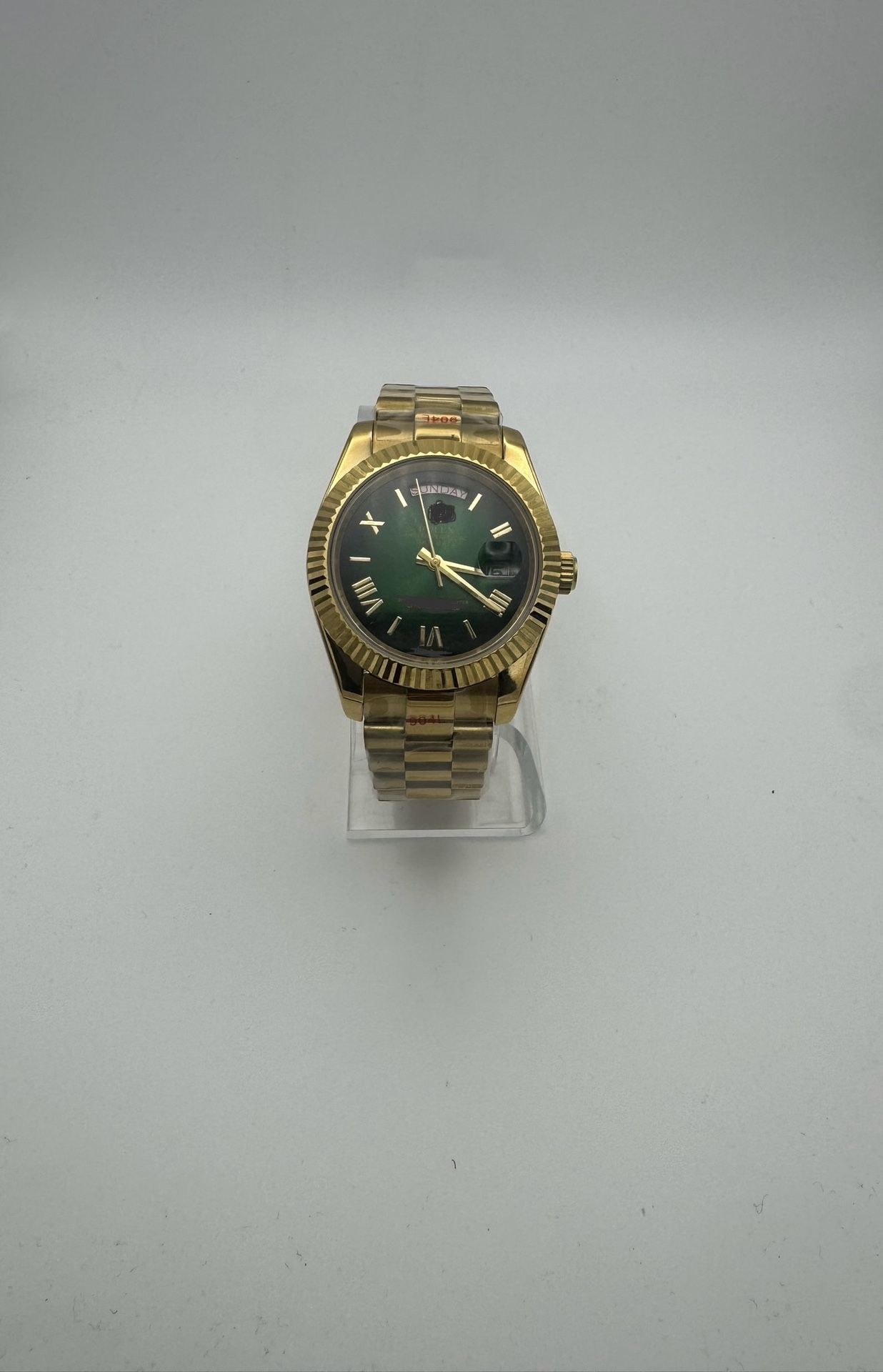 Gold-Tone Watch with Green Dial and Roman Numerals