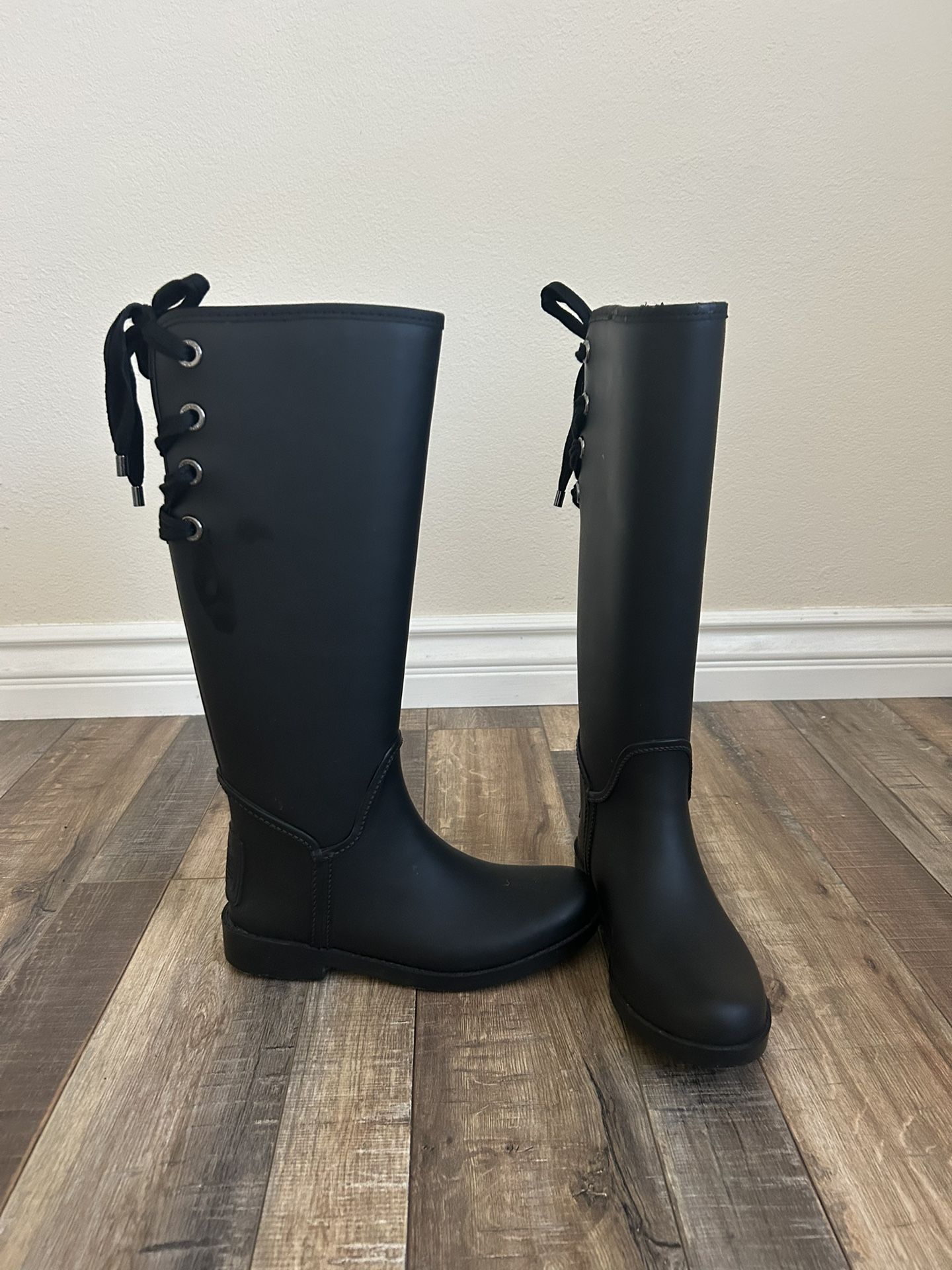 Size 6 Black coach rain boots with lace bow on back