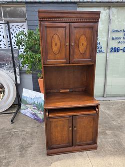 Cherry wood secretary desk with satinwood inlay details and a pull-out tray.