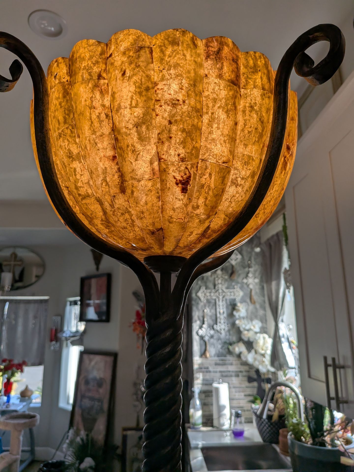 Maitland Smith scalloped floor lamp featuring a natural stone or shell shade in a twisted metal base.