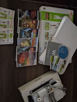 Wii fit bit plus with 2 balance boards and 6 games plus 3 fit plus games/ workout