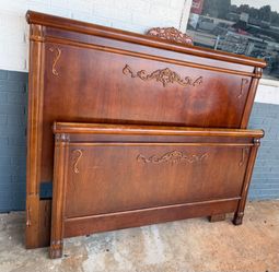 Wooden queen size bed with metal rails