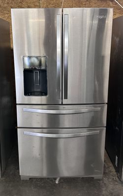 Whirlpool brand refrigerator with 4 doors made of stainless steel