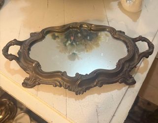 Mirrored plateaus, also known as mirrored trays or centrepieces, gained popularity during the 18th century, particularly in France, as decorative elem