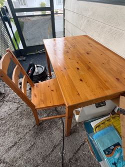IKEA wood dining table with 4 chairs.