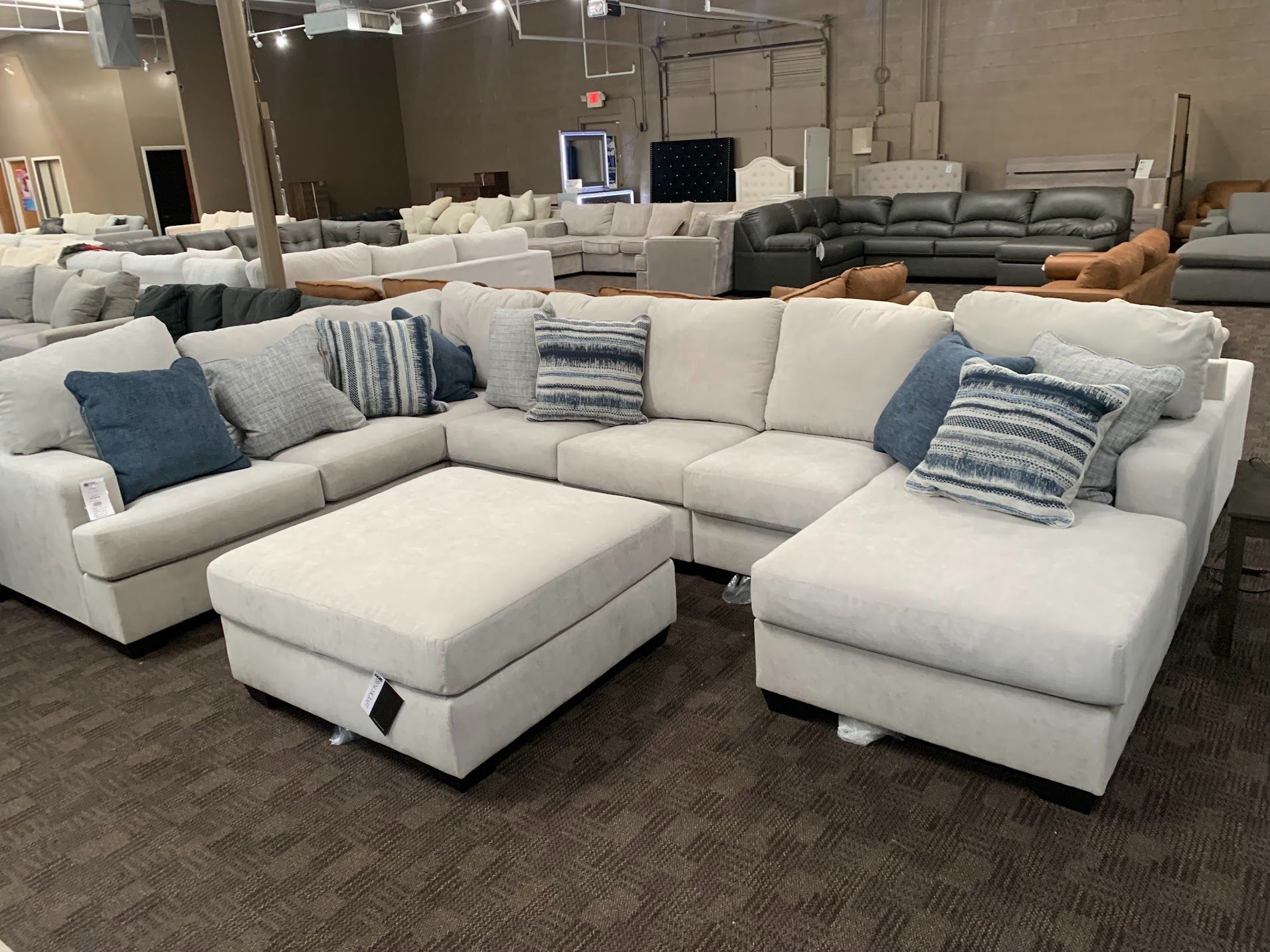 Light gray comfy sectional w/ blue accents 