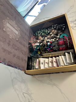 33 pieces of jewelry in book box