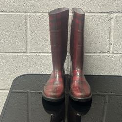 Sexy Chic Burberry burgundy Nova check rubber rain boots in a tall style.