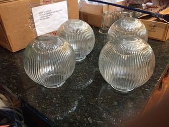 Light covers. Four matching solid glass light covers. Like new condition with no cracks or wear marks.