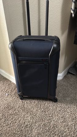 Tumi navy blue  Carry-On Spinner Luggage