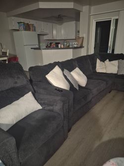 Dark gray sectional sofa turns into a pullout bed