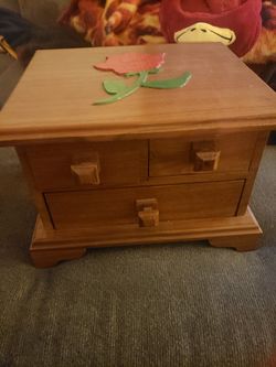 Jewelry box about 10inches tall. Drawers have felt in them and the legs have felt on bottom.