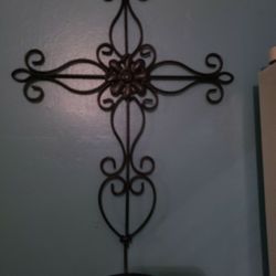 NEW METAL CROSS WITH CANDLE HOLDER.