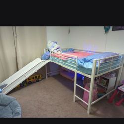 Metal bed with slide