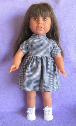 Girl doll 18” w extra clothes, shoes and pink travel case