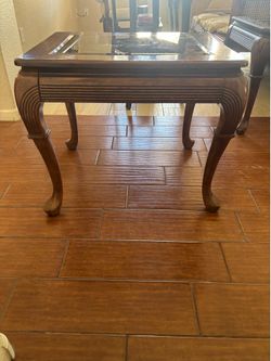 Two dark brown end tables
