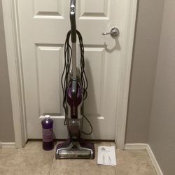 Bissell crosswave hard floor cleaner with an unopened bottle of specialized  floor cleaner      (excellent condition)