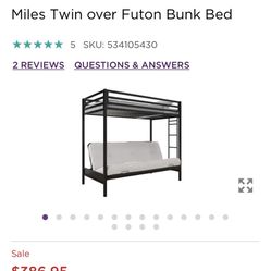 Black metal twin over futon bed