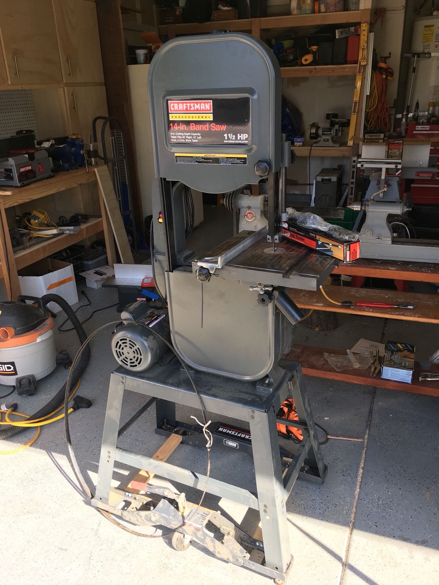 Craftsman Professional 14 in. band saw near new with stand and rollers. Make offer.