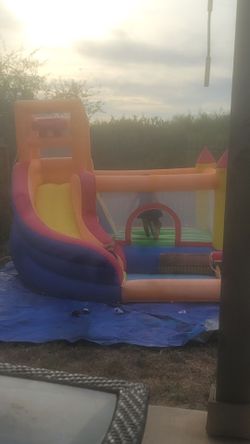Bounce house with slide and pool