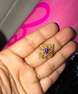Ornate Gold Ring with Purple Gemstone