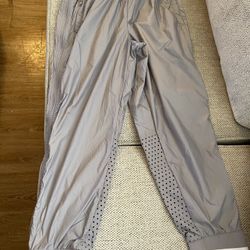 This is a pair of Adidas by Stella McCartney Barricade training pants in gray Small-