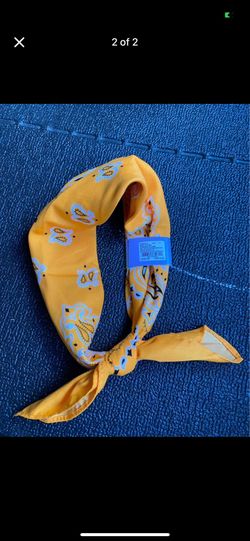 Bright yellow bandana/scarf with floral pattern.