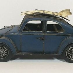 Vintage Blue Metal Volkswagen Bug with Surf Boards 