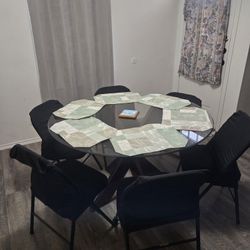 Beautiful expresso X-base glass table w/6 Folding chairs. Table alone was $500+
30"Hx 48"Wx 48"D 
