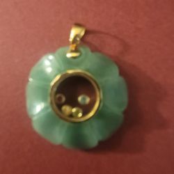 Pendant 14k Jade With tiny Stones in the middle.