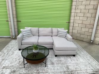 *Free Delivery* Gray Living Spaces Sectional Reversible Chaise