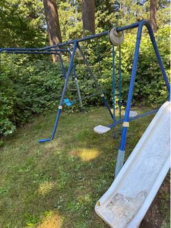 Broken and bent in places - metal swingset for free