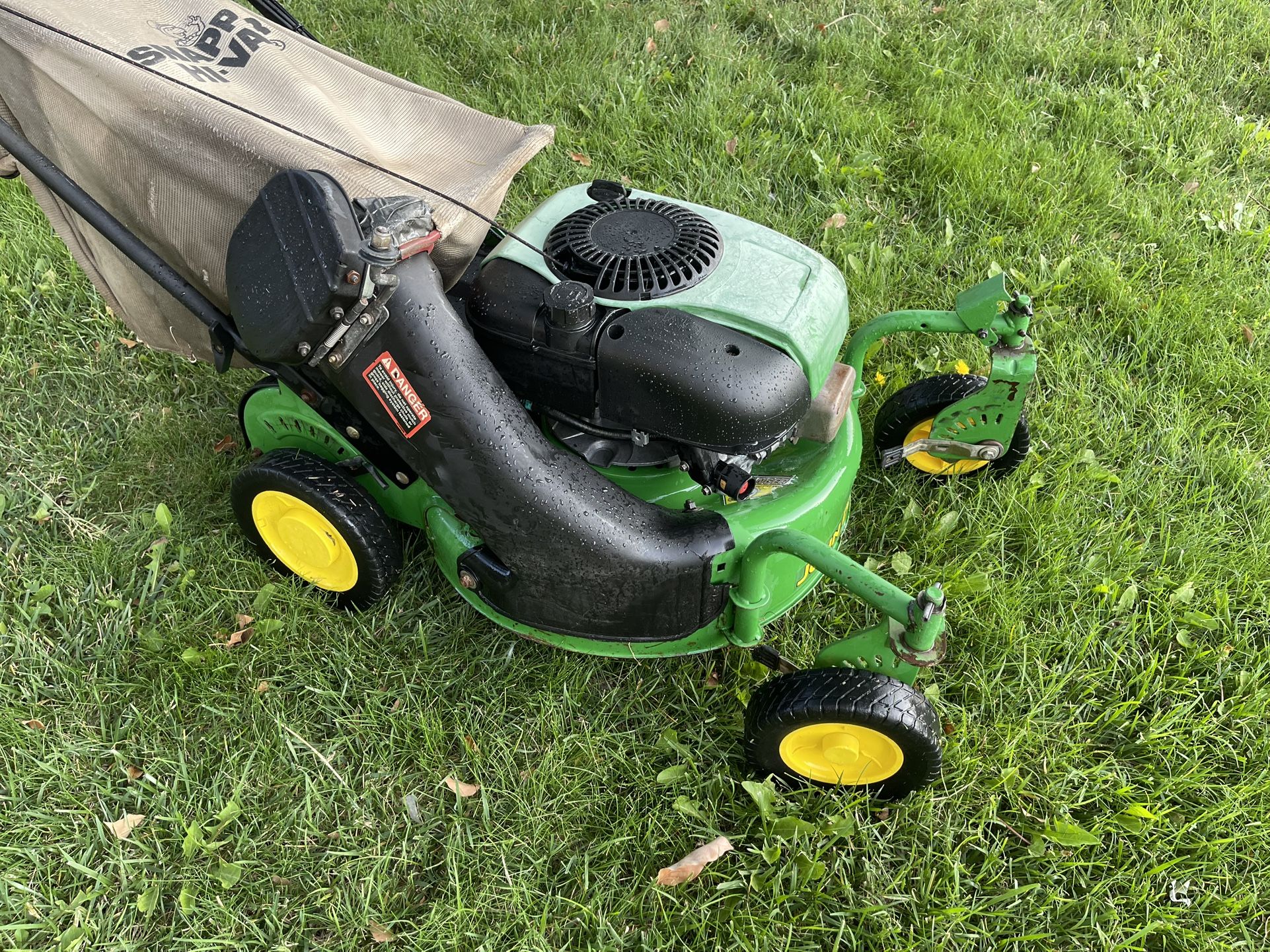 John Deere zero turn lawn mower, gas powered lawn mower.